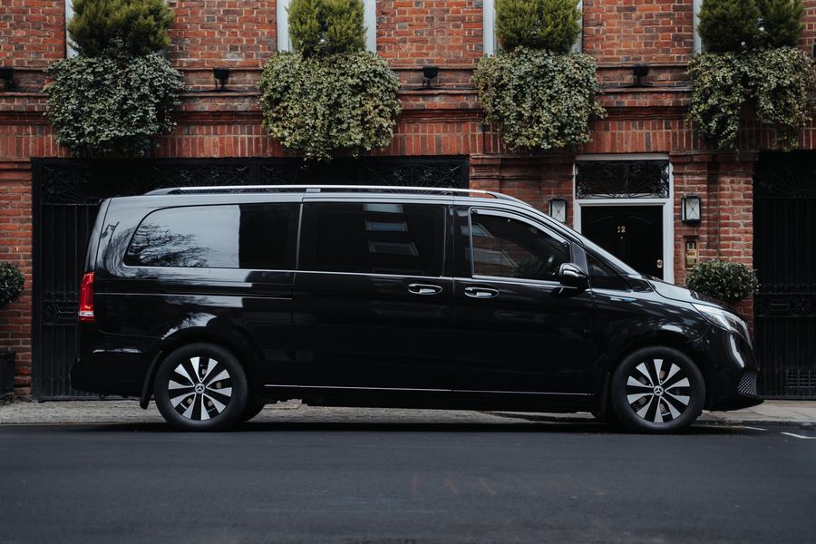 Side view of a Mercedes-Benz V-Class outside a red-brick London house